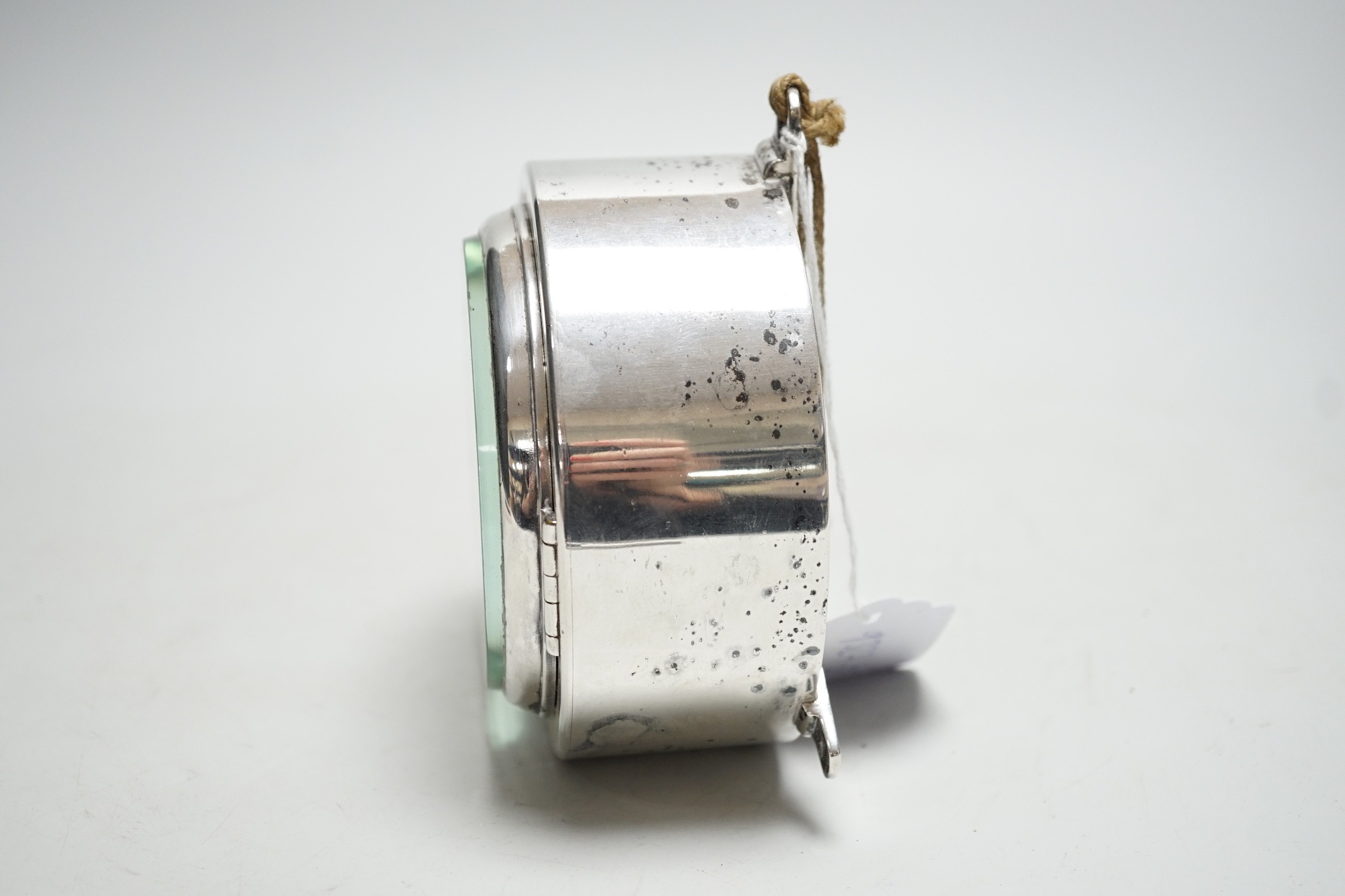A small silver plated ship's clock, inscribed ‘Siren’ R.M.Y.C.